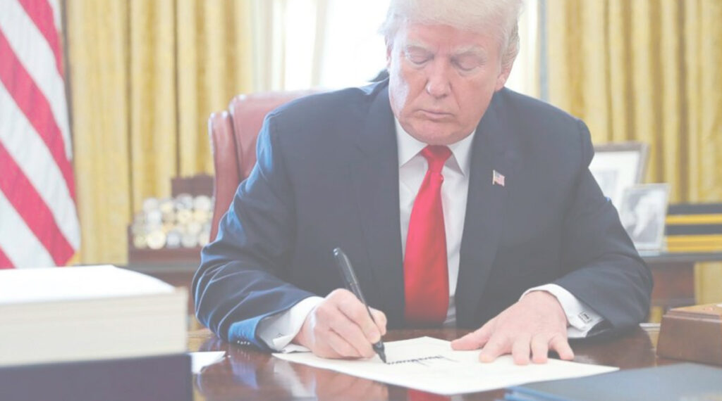 Donald Trump signing a document