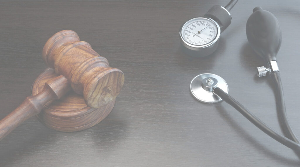 stethoscope and gavel resting on a table